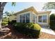 Well-maintained exterior with beautiful landscaping and mature trees creates a welcoming curb appeal at 3071 Shoal Creek Village Dr, Lakeland, FL 33803