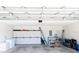 Spacious garage features ample storage, clean floors, and great lighting at 3071 Shoal Creek Village Dr, Lakeland, FL 33803
