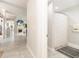 Inviting hallway view showcasing a fireplace and seamlessly connecting living spaces at 3071 Shoal Creek Village Dr, Lakeland, FL 33803