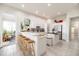 Open kitchen featuring a breakfast bar, ample cabinet space, and modern stainless steel appliances at 3071 Shoal Creek Village Dr, Lakeland, FL 33803