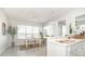 Open-concept kitchen and breakfast nook featuring lots of natural light and tile flooring at 3071 Shoal Creek Village Dr, Lakeland, FL 33803