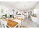 Open concept kitchen next to dining area with lots of natural light and white cabinetry at 3071 Shoal Creek Village Dr, Lakeland, FL 33803