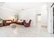 Open-concept living room with neutral decor, tile flooring, and ample space for furniture arrangement at 3071 Shoal Creek Village Dr, Lakeland, FL 33803