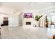 Well-lit living room with tile flooring, a fireplace, and access to other rooms in the home at 3071 Shoal Creek Village Dr, Lakeland, FL 33803
