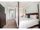 Elegantly appointed main bedroom featuring a four-poster bed and access to a hallway at 3071 Shoal Creek Village Dr, Lakeland, FL 33803