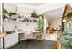 Bright home office with built-in shelves, a comfortable chair, stylish decor, and views into living room at 3071 Shoal Creek Village Dr, Lakeland, FL 33803