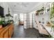 Bright sunroom with a desk, tiled floor, plenty of natural light, and stylish decor, perfect for relaxation at 3071 Shoal Creek Village Dr, Lakeland, FL 33803