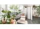 Cozy sunroom with plenty of natural light, comfortable seating, privacy screen and plants, perfect for relaxation at 3071 Shoal Creek Village Dr, Lakeland, FL 33803