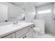 Updated bathroom features walk-in shower, a white marble countertop, and a single sink at 3080 Westmoreland Dr, Lakeland, FL 33810