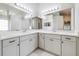 Large bathroom with double vanity, white marble countertop, and large mirrors at 3080 Westmoreland Dr, Lakeland, FL 33810