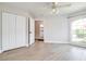 Bedroom with closet, and a light wood floor with a large arched window at 3080 Westmoreland Dr, Lakeland, FL 33810