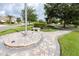 Community park featuring a memorial, benches, and a circular brick-paved path at 3080 Westmoreland Dr, Lakeland, FL 33810