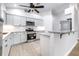 Bright kitchen features stainless steel appliances, white cabinetry, and granite countertops at 3080 Westmoreland Dr, Lakeland, FL 33810