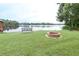 The lakefront offers a firepit and a bench at 3080 Westmoreland Dr, Lakeland, FL 33810