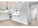 Open-concept living space featuring light wood floors, recessed lighting, and a bar area at 3080 Westmoreland Dr, Lakeland, FL 33810