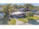 Charming home with a well-manicured lawn, complemented by mature trees and a welcoming facade at 3134 Hilltop S Ave, Lakeland, FL 33803