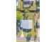 Aerial view of home showcasing the metal roof and proximity to a screened-in pool at 3134 Hilltop S Ave, Lakeland, FL 33803