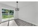 Bright dining area with sliding glass doors providing backyard access and natural light at 3134 Hilltop S Ave, Lakeland, FL 33803