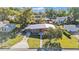 Charming single-story home featuring a well-manicured lawn, updated wood accents and a metal roof at 3134 Hilltop S Ave, Lakeland, FL 33803