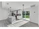 Bright, open kitchen with stainless appliances, an island, a view of the backyard and recessed lighting at 3134 Hilltop S Ave, Lakeland, FL 33803