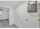 Functional utility room equipped with modern appliances and fixtures, perfect for laundry and storage needs at 3134 Hilltop S Ave, Lakeland, FL 33803