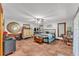 Bright bedroom showcasing a large bed, ceiling fan, and tile floor, offering a peaceful retreat at 3530 Hamilton Rd, Lakeland, FL 33811
