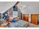 Comfortable bedroom with ceiling fan, carpeting, and large window at 3530 Hamilton Rd, Lakeland, FL 33811