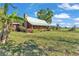 Exterior view of home featuring a metal roof and chimney at 3530 Hamilton Rd, Lakeland, FL 33811