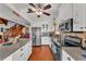 Spacious kitchen featuring white cabinets, stainless appliances, and granite countertops at 3530 Hamilton Rd, Lakeland, FL 33811