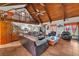 Spacious open-concept living area with vaulted wood ceilings, a loft, and comfortable seating at 3530 Hamilton Rd, Lakeland, FL 33811