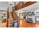 Spacious living room featuring hardwood floors, natural light, and a staircase at 3530 Hamilton Rd, Lakeland, FL 33811