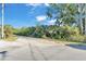 A charming street view with lush greenery and a tranquil setting under a beautiful blue sky at 3530 Hamilton Rd, Lakeland, FL 33811