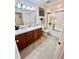 Bathroom features double sinks, modern fixtures, and a glass-enclosed shower, offering a spa-like experience at 3846 Exeter Ln, Lakeland, FL 33810