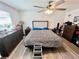 Bedroom with a ceiling fan, a large bed, and plenty of storage space at 3846 Exeter Ln, Lakeland, FL 33810