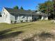 Beautifully landscaped single-story home with charming curb appeal, an attached garage, and decorative touches at 4215 Sabal Palm Dr, Mulberry, FL 33860