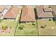 Aerial view of a fenced backyard showcasing lush green grass and privacy between neighboring homes at 4232 Prima Lago Dr, Lakeland, FL 33810