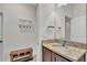 Bathroom with granite countertop, sink, with white door and hooks on the wall at 4232 Prima Lago Dr, Lakeland, FL 33810