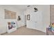 Bright bedroom with a large world map on the wall, a double door closet, and natural light at 4232 Prima Lago Dr, Lakeland, FL 33810