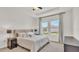 Cozy bedroom with plush carpet, natural light, and neutral tones, offers a serene retreat at 4232 Prima Lago Dr, Lakeland, FL 33810