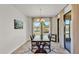 Cozy dining room with natural light from surrounding windows, and backyard view at 4232 Prima Lago Dr, Lakeland, FL 33810