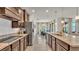 Modern kitchen with granite countertops, stainless steel appliances, and tiled floors at 4232 Prima Lago Dr, Lakeland, FL 33810