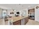 Spacious kitchen island with granite counters opens to a comfortable living area at 4232 Prima Lago Dr, Lakeland, FL 33810