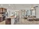 Open concept living space connecting kitchen with island, dining and comfortable living area at 4232 Prima Lago Dr, Lakeland, FL 33810