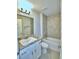 Bathroom features a bathtub, shower, vanity and tiled wall at 4322 Juliana Lake Dr, Auburndale, FL 33823