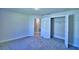 Bedroom features neutral carpet, a walk-in closet, and ensuite bathroom access at 4322 Juliana Lake Dr, Auburndale, FL 33823