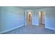 Bedroom features neutral carpet, a walk-in closet, and ensuite bathroom access at 4322 Juliana Lake Dr, Auburndale, FL 33823