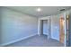 Bedroom features neutral carpet, a walk-in closet, and ensuite bathroom access at 4322 Juliana Lake Dr, Auburndale, FL 33823