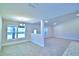 Bright dining room with natural light, tiled floors, and modern chandelier at 4322 Juliana Lake Dr, Auburndale, FL 33823