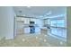 Modern kitchen featuring white cabinets, granite countertops, and a central island at 4322 Juliana Lake Dr, Auburndale, FL 33823