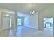 Open-concept living space with tiled floors, high ceilings, and plenty of natural light at 4322 Juliana Lake Dr, Auburndale, FL 33823